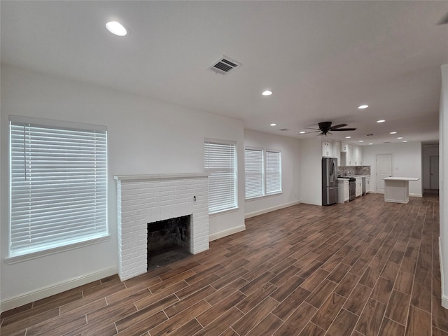 1307 Brooks Ave, Rosenberg, TX 77471 - unfurnished living room featuring a fireplace, ceiling fan, baseboards, and recessed lighting
