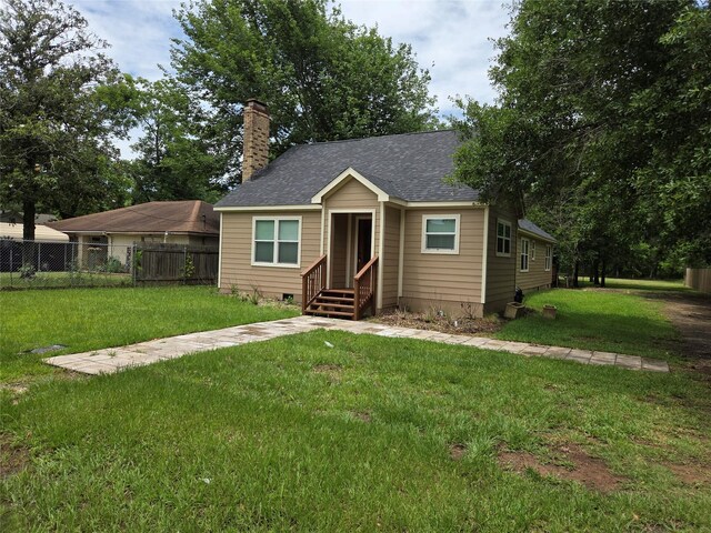 1307 Brooks Ave, Rosenberg, TX 77471 - bungalow-style home featuring a chimney and a shingled roof