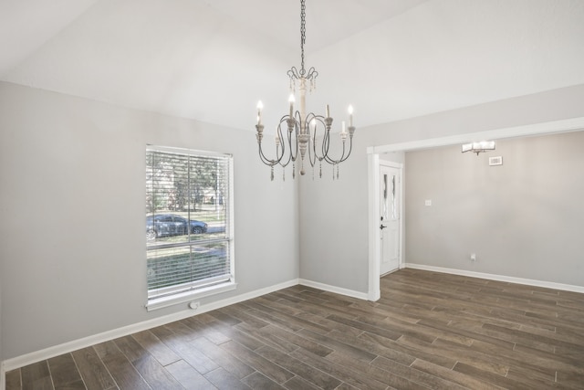 unfurnished dining area featuring a notable chandelier, lofted ceiling, and dark hardwood / wood-style floors