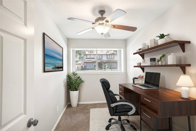 office area with light carpet and ceiling fan