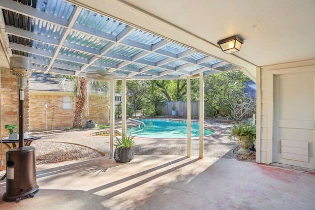 view of swimming pool featuring a patio area and a pergola