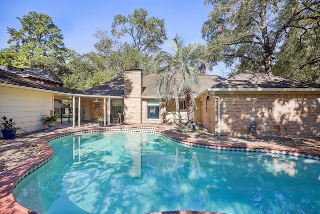 view of swimming pool with a patio area