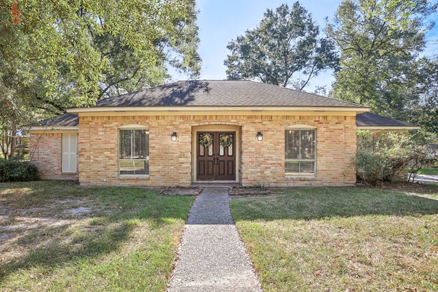 view of front of property featuring french doors and a front yard