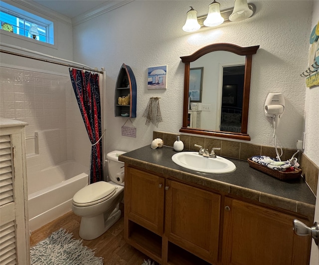 full bathroom featuring shower / bath combination with curtain, hardwood / wood-style flooring, crown molding, vanity, and toilet