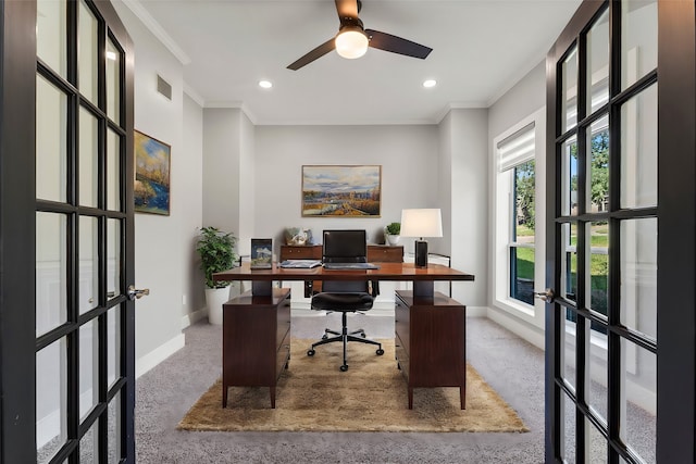 carpeted office space with ceiling fan, french doors, and ornamental molding