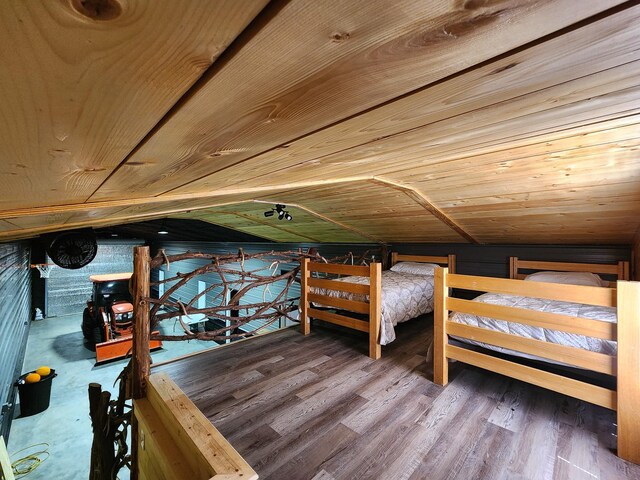 unfurnished bedroom featuring wooden ceiling and hardwood / wood-style floors