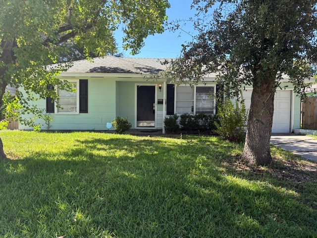 single story home featuring a front yard and a garage