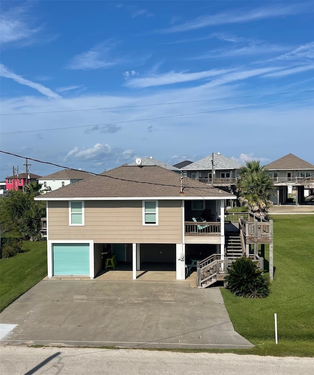 view of front facade featuring a front lawn and a carport