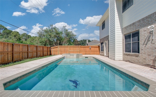 view of pool featuring an in ground hot tub