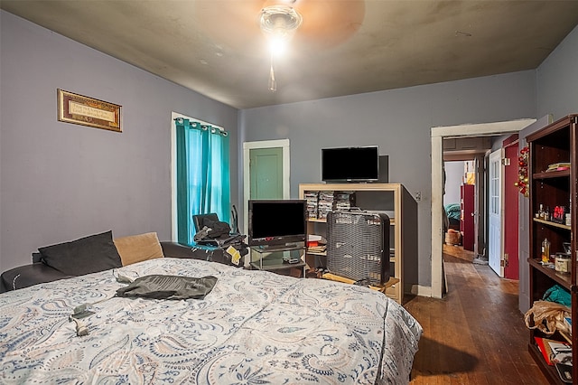 bedroom featuring ceiling fan and dark hardwood / wood-style flooring