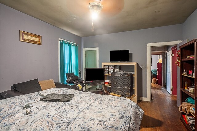4995 Highland Ave, Beaumont, TX 77705 - bedroom featuring wood finished floors and a ceiling fan