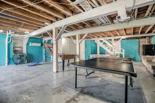 basement featuring a wall mounted AC