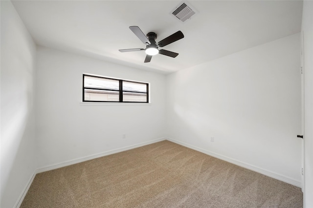 empty room with carpet flooring and ceiling fan