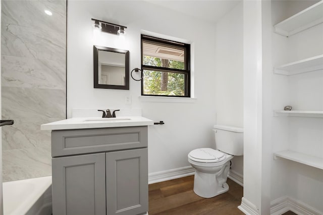 full bathroom featuring wood-type flooring, vanity, toilet, and shower / washtub combination