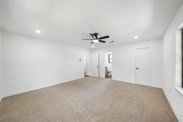 unfurnished room featuring light carpet and ceiling fan