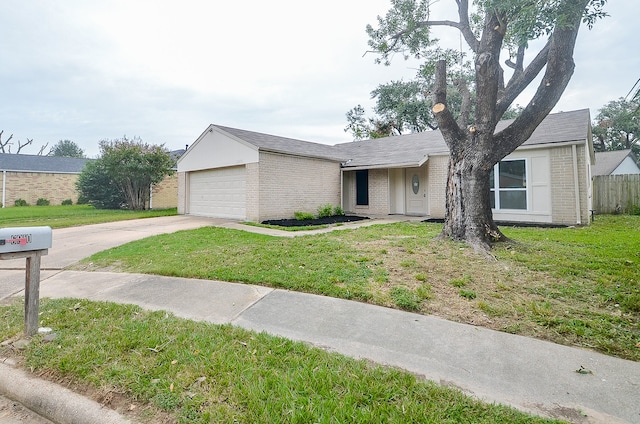 ranch-style home with a front lawn and a garage