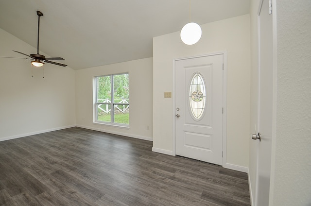 foyer with vaulted ceiling, dark wood-type flooring, and ceiling fan