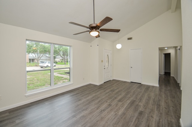 unfurnished living room featuring ceiling fan, dark hardwood / wood-style floors, and a wealth of natural light