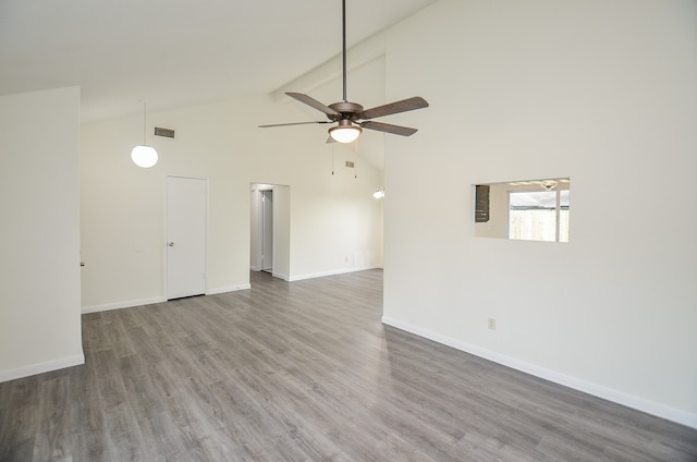 spare room with ceiling fan, dark hardwood / wood-style flooring, and high vaulted ceiling