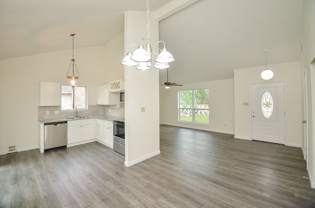 kitchen with wood-type flooring, sink, ceiling fan with notable chandelier, white cabinets, and appliances with stainless steel finishes