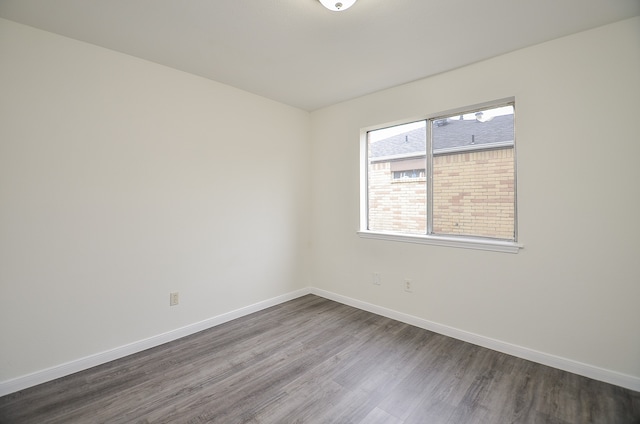 empty room with hardwood / wood-style floors