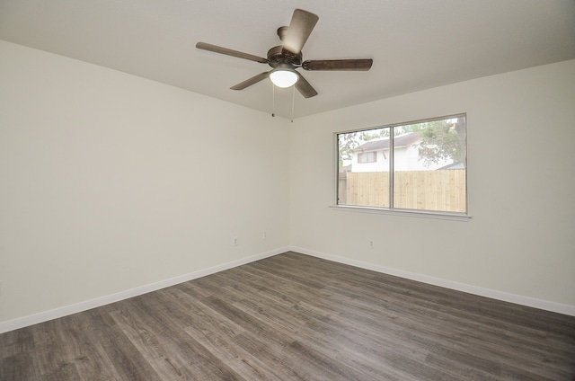 unfurnished room with ceiling fan and dark hardwood / wood-style floors