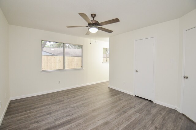 spare room featuring ceiling fan and hardwood / wood-style flooring