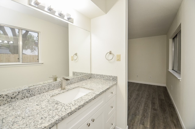 bathroom with vanity and hardwood / wood-style flooring