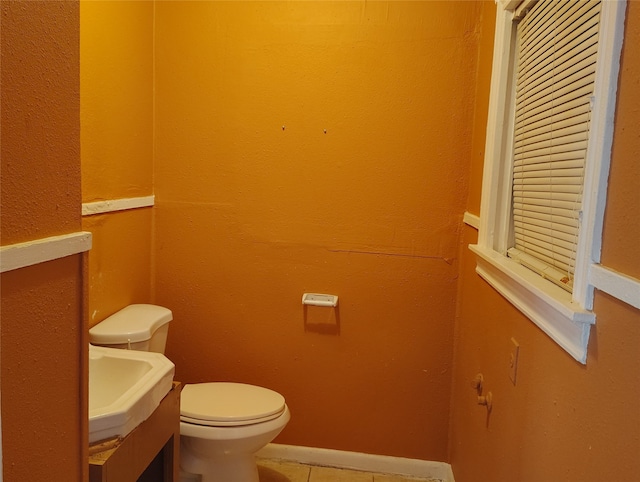 bathroom featuring vanity, toilet, and tile patterned floors