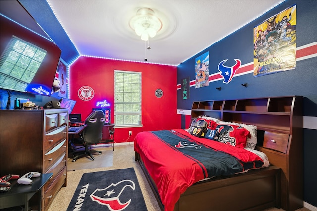 bedroom featuring carpet flooring and vaulted ceiling