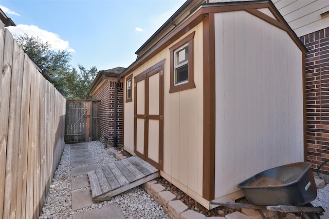 view of property exterior featuring a shed