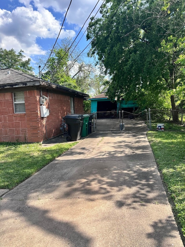 view of side of home featuring a lawn