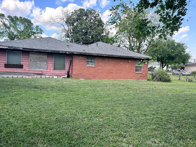 back of house with a yard