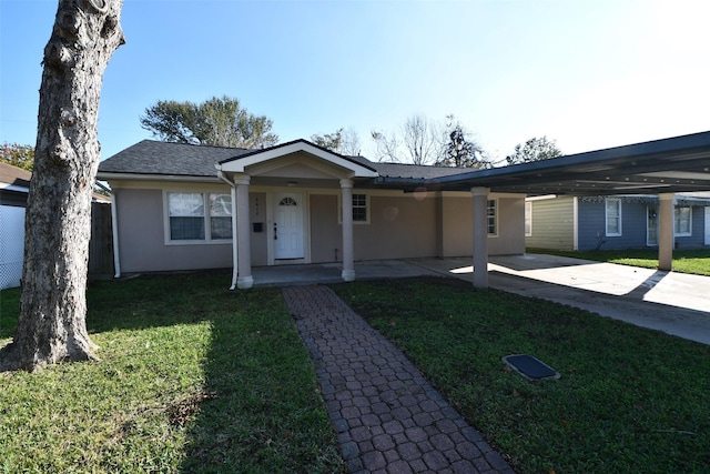 ranch-style house featuring a front yard and a carport