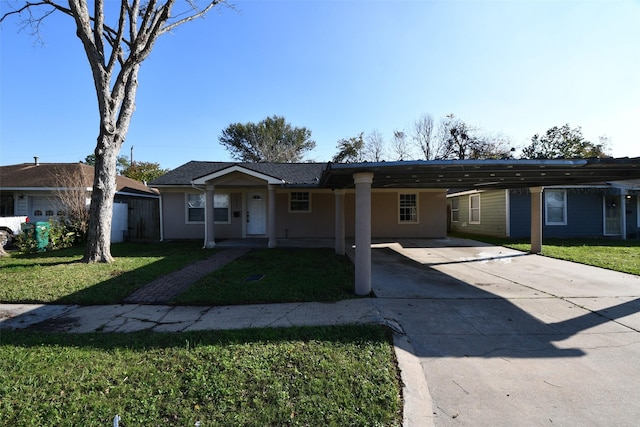 ranch-style home with a carport and a front yard