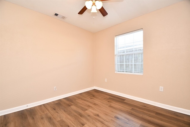 unfurnished room with hardwood / wood-style floors and ceiling fan