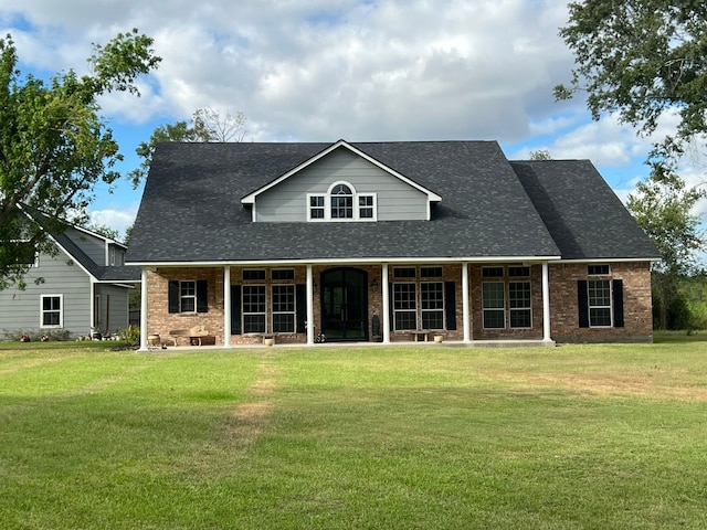 rear view of house with a yard