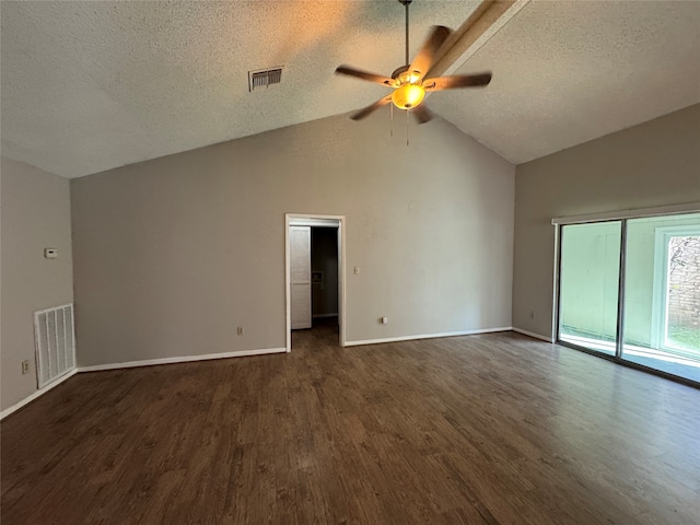 empty room with a textured ceiling, dark hardwood / wood-style floors, ceiling fan, and lofted ceiling