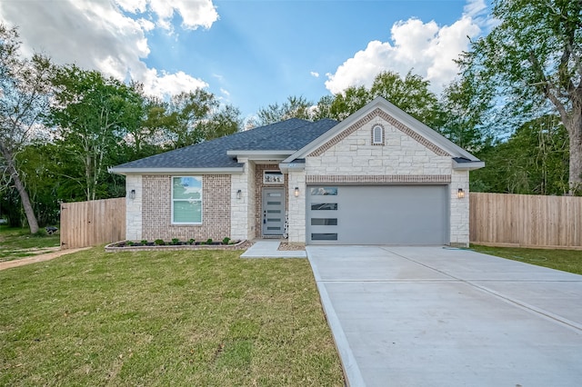 view of front of property with a garage and a front yard