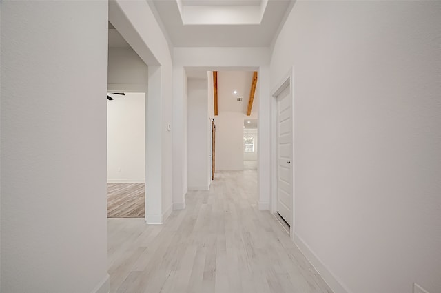 corridor with light hardwood / wood-style flooring