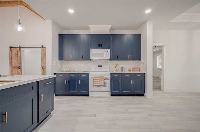 kitchen with blue cabinetry, white appliances, hanging light fixtures, a barn door, and light hardwood / wood-style flooring