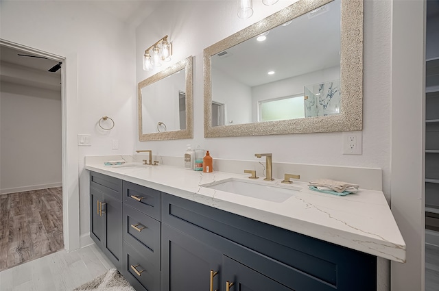 bathroom featuring vanity and hardwood / wood-style flooring