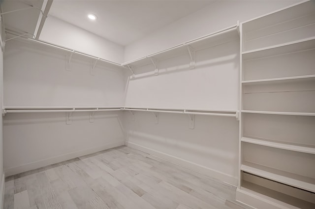 walk in closet featuring light hardwood / wood-style flooring