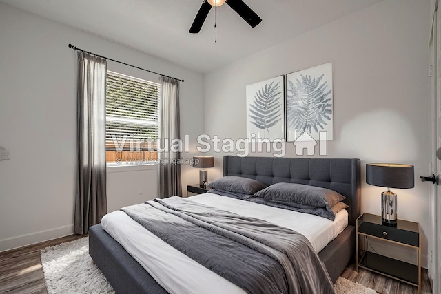 bedroom with ceiling fan and hardwood / wood-style floors