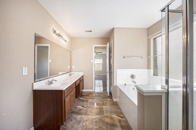 bathroom with shower with separate bathtub and vanity