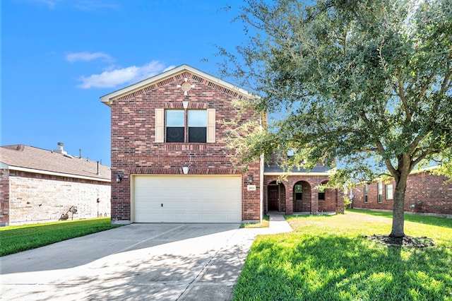 view of front facade with a front yard and a garage