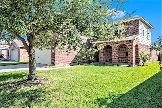 view of front of house featuring a garage and a front lawn