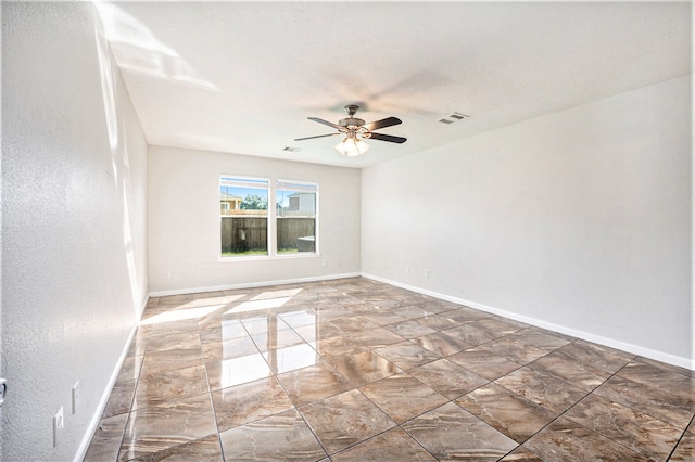 spare room with ceiling fan