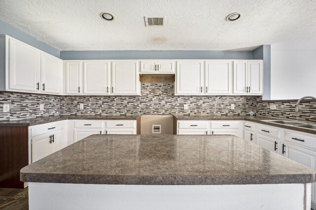 kitchen featuring white cabinetry and a kitchen island