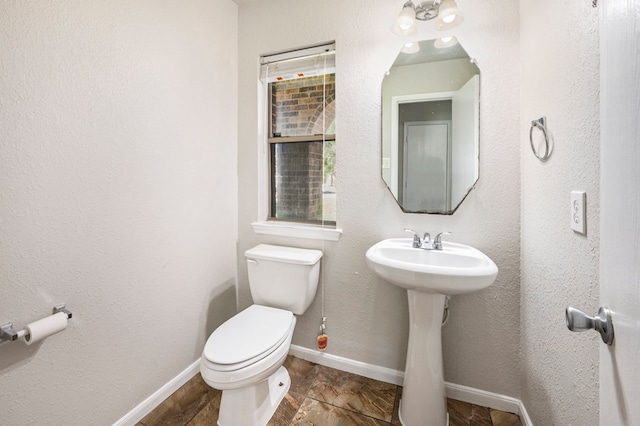 bathroom featuring toilet